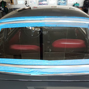 The rear window trim was scratched and stained