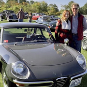 Gary and Colleen pose next to Gary's 330,000-mile Duetto