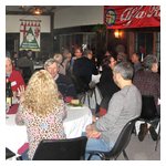 A stitched-together shot of the main dining room — lots of great food and drink