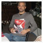 Michael Leccese drew #1 in the Yankee Swap, got to choose from all of the gifts, and went with Pat Braden's Alfa Romeo Owner's Bible