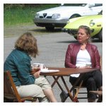 Angela Nannini (L) and Meg Anderson enjoying the afternoon at an elegant portable wooden picnic set