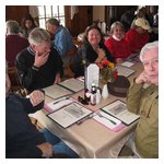 Our gang gathers at a rectangular table...