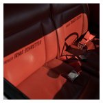 The sun shining through the windshield graphics of Roger's 1900 CSS projects them onto the seat backs