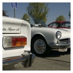 Study in white — the tail of Rick & Linda Lesniewicz's Giulia Super and nose of Garry Prime's Giulietta