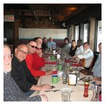 One end of the table of smiling motorists at the Mill Wharf restaurant...
