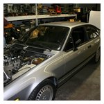 Paul Glynn next to a nice-looking GTV6 in for service