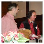 Dave France appears to be eying the previously-opened presents for something to swap