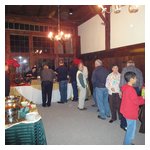The partygoers begin to queue up as the buffet starts to be served