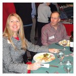 Meg Anderson smiles broadly upon learning that Jim Miga is recently engaged!!!