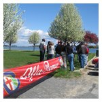 The drivers meeting with Alfa Romeo banner wafting in the breeze