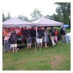 The AONE canopies were a welcome retreat. Debra Leccese can be seen futilely praying for the rain to stop
