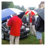 Judges Kevin Murphy and Andy Kress evaluating the entries through the wetness