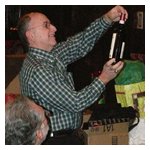 Gene Durso checking the vintage of the bottle of wine he'd opened