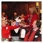 A swap taking place — Arline France relinquishes her gift to Donna D'Amore