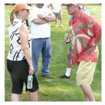 Karen St. Clair and Same giving each other the 'We did it!' look with Steve looking on