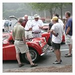 BMCNE's Bob Stahlbush points out some of the features of his magnificently restored red TR-3