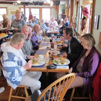 Some photos of the Crusaders relaxing at the tables we occupied at the Fish Monger Café in Woods Hole