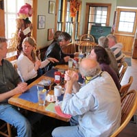 Some photos of the Crusaders relaxing at the tables we occupied at the Fish Monger Café in Woods Hole