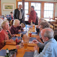 Some photos of the Crusaders relaxing at the tables we occupied at the Fish Monger Café in Woods Hole