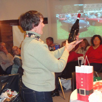Barb Durnan likes the vintage on the bottle of wine she unwrapped