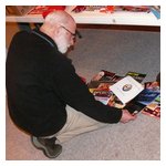 George Dolak peruses some of the free literature that Jim Miga donated