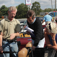 Debby gets some pointers from fellow '88 Spider owner Dan Donovan while Peter Walker officiates