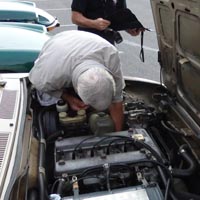 Frank attempts to tighten the offending oil pressure sender