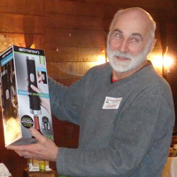 George Dolak unwraps an electric wine opener, but ...
