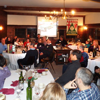 The crowd is enraptured and bemused as the Yankee gift swap gets under way