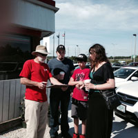 Director George trying to recruit a volunteer for leading the tour