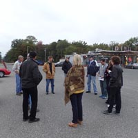 The drivers' meeting with the Fillin' Station Diner in the background