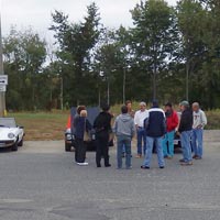 A panoramic shot of all our Alfas with the drivers' meeting in the foreground