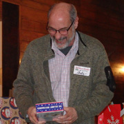 Andy Kress is highly amused by the contents of the package he unwrapped ...