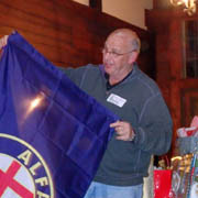 Roger Cassin will be flying the Alfa Romeo banner he received from his race car trailer next year