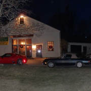 Meanwhile, outside in front of the Tavern, four Alfas await the return of their party-going drivers