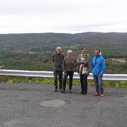 The Rowntrees and Kradjians with the view from the Golden Eagle behind them
