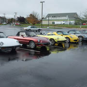 Our Alfas etc. arrive in a damp Patriot Square parking lot