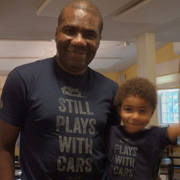 Axel and Frank Anigbo sporting their 'Plays With Cars' and 'Still Plays With Cars' T-shirts