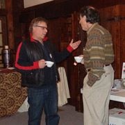 A serious-looking discussion between Jonathan Kirshtein and Tom Ducibella