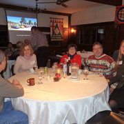 A few photos of the holiday revelers gathered around the five large tables we occupied