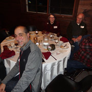 A few photos of the holiday revelers gathered around the five large tables we occupied
