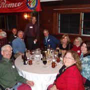 A few photos of the holiday revelers gathered around the five large tables we occupied