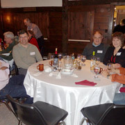 A few photos of the holiday revelers gathered around the five large tables we occupied
