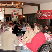Several shots of the crowd gathered at their tables in the banquet room