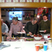 A few shots of the hungry revelers attacking the banquet table