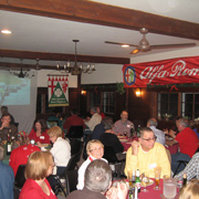 Several shots of the crowd gathered at their tables in the banquet room