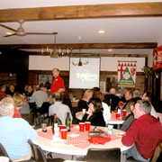 Several shots of the crowd gathered at their tables in the banquet room