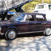 Fred Frey's Giulia Super in front of a truck that just unloaded its apples onto the conveyor