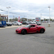 Phil Kotsios backs his 4C coupe into a space in our row