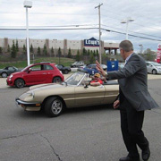 Sales Manager Steve Parke waving goodbye to the departing Alfisti